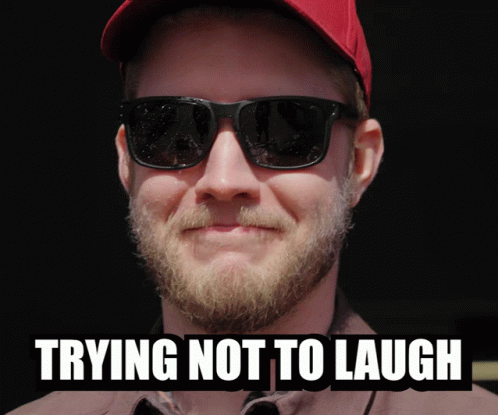 Trying Not To Laugh Man in Red Hat and Sunglasses