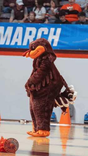 Turkey Mascot in Front of March Banner