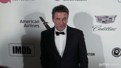Tuxedo Man Facing Wall With American Airlines, Cadillac, IMDb GIF