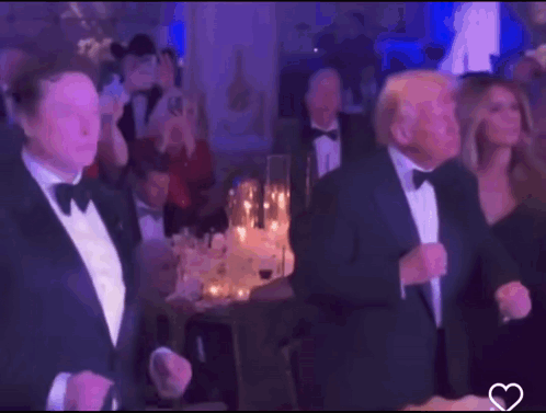 Tuxedo Man Next to Bow Tie Man in Crowd