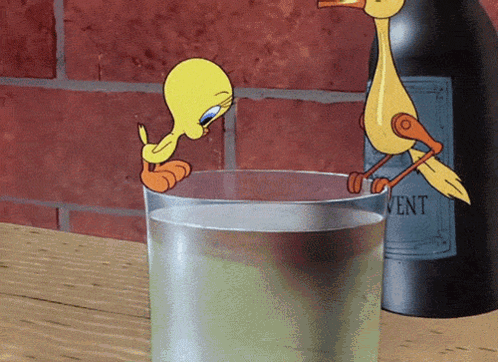Tweety Drinking From Glass Next to Bottle of Vent