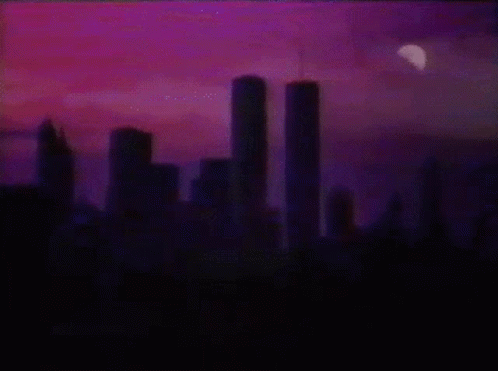 Twin Towers Lit Up At Night GIF