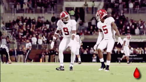 Two Alabama Football Players Number 9 and 5 Dancing