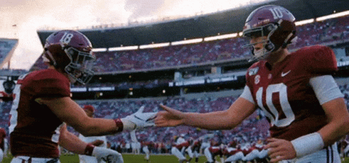 Two Alabama Football Players Shaking Hands
