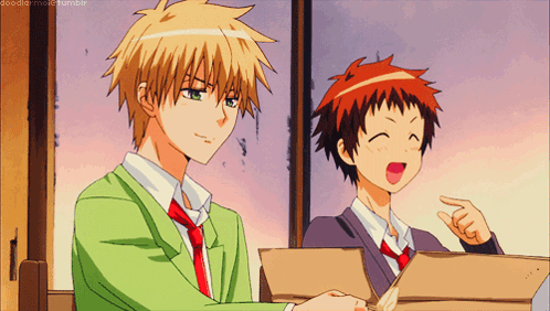 Two Anime Characters Are Sitting Next To Each Other And One Of Them Is Pointing GIF