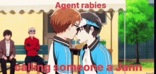 Two Anime Characters Kissing in Front of Crowd