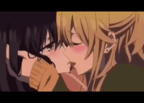 Two Anime Girls Are Kissing Each Other In A Close Up . GIF