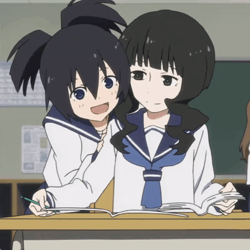 Two Anime Girls Are Sitting At A Desk With A Book GIF