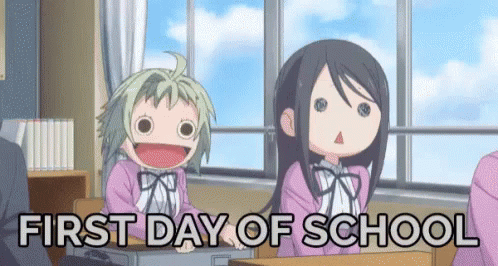 Two Anime Girls Are Sitting At Desks In A Classroom With The Words `` First Day Of School '' . GIF
