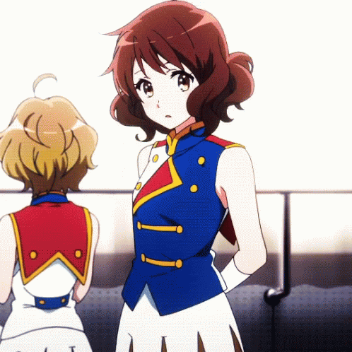 Two Anime Girls Are Standing Next To Each Other And One Has A Blue Vest On GIF