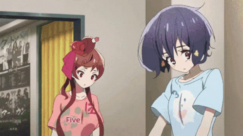 Two Anime Girls Are Standing Next To Each Other And One Has A Shirt That Says Five On It GIF