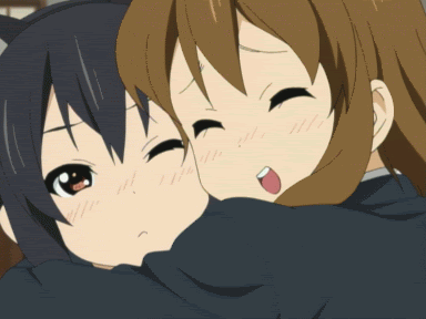 Two Anime Girls Hugging One With Cat on Head