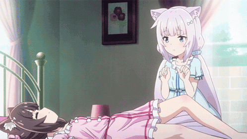 Two Anime Girls Laying On Bed One With Cat Ear GIF