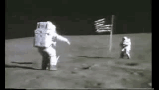 Two Astronauts Are Walking On The Moon . GIF