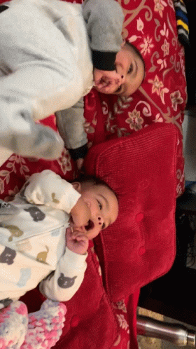 Two Babies Lying Next to Each Other