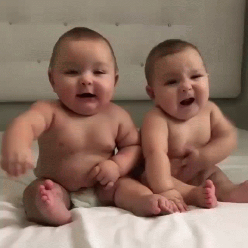 Two Baby Boys Smiling