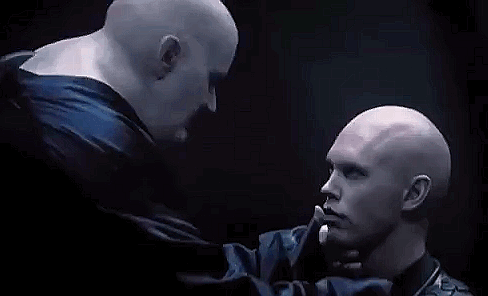 Two Bald Men Kissing in Dark Room