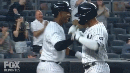 Two Baseball Players Hugging Fox Deportes Logo