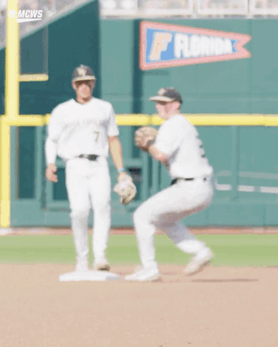 Two Baseball Players in Front of Florida Banner