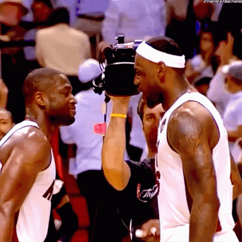 Two Basketball Players And Cameraman Taking Picture GIF