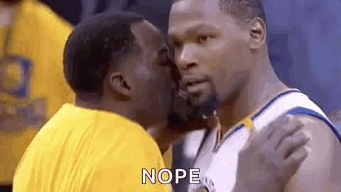 Two Basketball Players Are Kissing Each Other During A Game . GIF