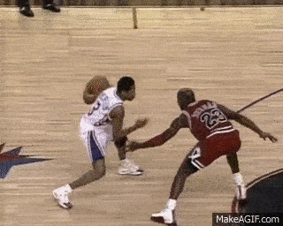 Two Basketball Players Are Playing A Game Of Basketball And One Of Them Has The Number 23 On His Back GIF