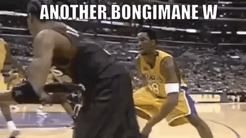 Two Basketball Players Are Playing A Game Of Basketball On A Court . One Of The Players Is Wearing A Yellow Jersey . GIF