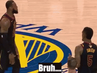 Two Basketball Players Are Standing In Front Of A Golden State Warriors Logo GIF