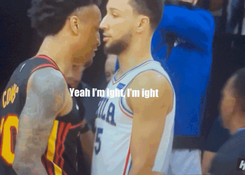 Two Basketball Players Are Standing Next To Each Other And One Of Them Has The Number 5 On His Jersey GIF