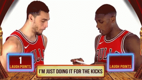 Two Basketball Players Are Standing Next To Each Other With A Sign That Says " Laugh Points " GIF