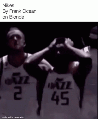 Two Basketball Players Are Standing Next To Each Other With Their Hands On Their Heads . GIF