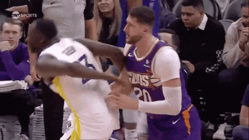 Two Basketball Players Fighting
