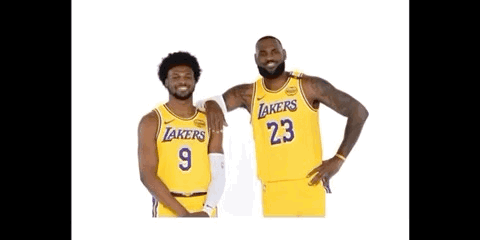 two basketball players for the lakers are posing for a picture