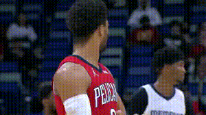 Two Basketball Players in Red and White Jerseys