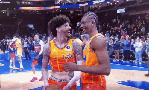Two Basketball Players On A Court With One Wearing A Jersey That Says Latte GIF