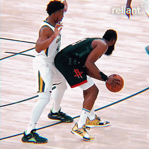 Two Basketball Players On A Court With The Word Reliant On The Bottom Right GIF
