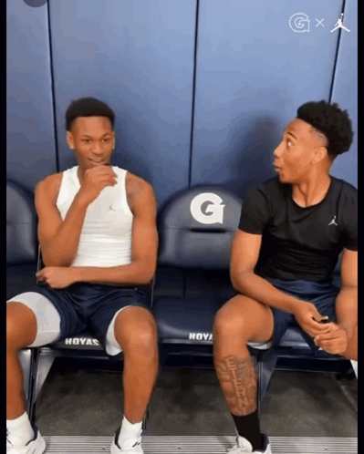 Two Basketball Players On Bench With Gatorade GIF
