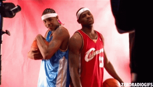 Two Basketball Players One In A Red Jersey With The Number 13 On It GIF