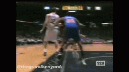 Two Basketball Players One In Blue Jersey GIF