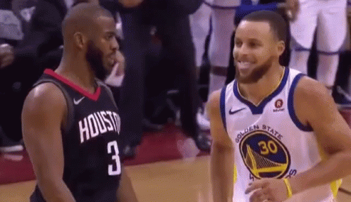 Two Basketball Players Smiling on Court