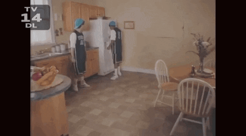 Two Basketball Players Standing In A Kitchen With The Number 14 On The Bottom Left GIF