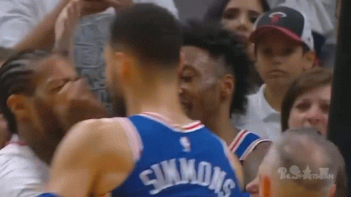 Two Basketball Players Standing In Front Of Crowd GIF