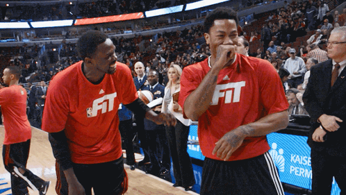 Two Basketball Players Wear Red Shirts That Say Fit GIF