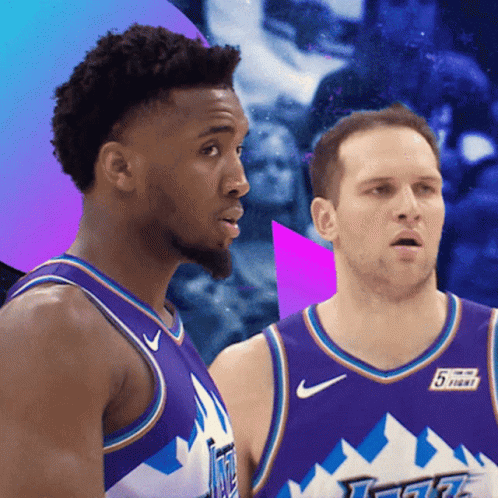 Two Basketball Players Wearing Purple Jerseys With The Number 5 On Them GIF
