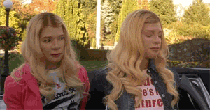 Two Blonde Women Are Sitting In A Car . GIF