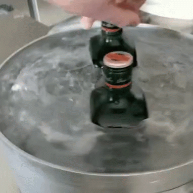 Two Bottles Pouring Into Water Bowl