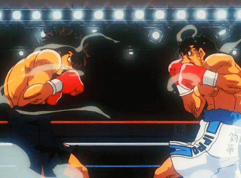 Two Boxers Are Fighting In A Ring And One Of Their Shorts Has The Word Ippo On It GIF