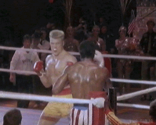 Two Boxers Fighting in Ring