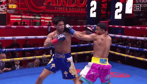 Two Boxers Fighting in Ring One Wearing King Shorts