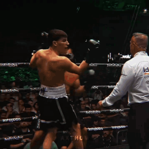 Two Boxers Fighting in Ring With Infojobs on Ropes
